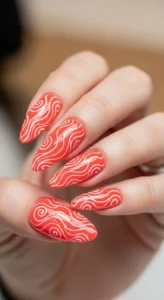 Coral Nails with White Swirls