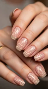 6. Minimalist Nude Swirl Nails