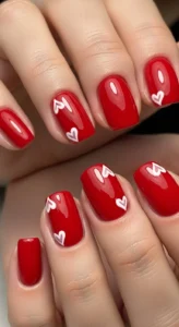 Cherry Red Nails With Cute Heart Art